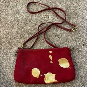 HOBO Darcy Crossbody Convertible Wristlet in red with gold metallic cow hide